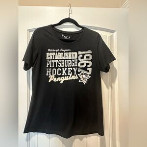 Pittsburgh Penguins Women’s Black Graphic Tee with sewn on lettering & appliqué.